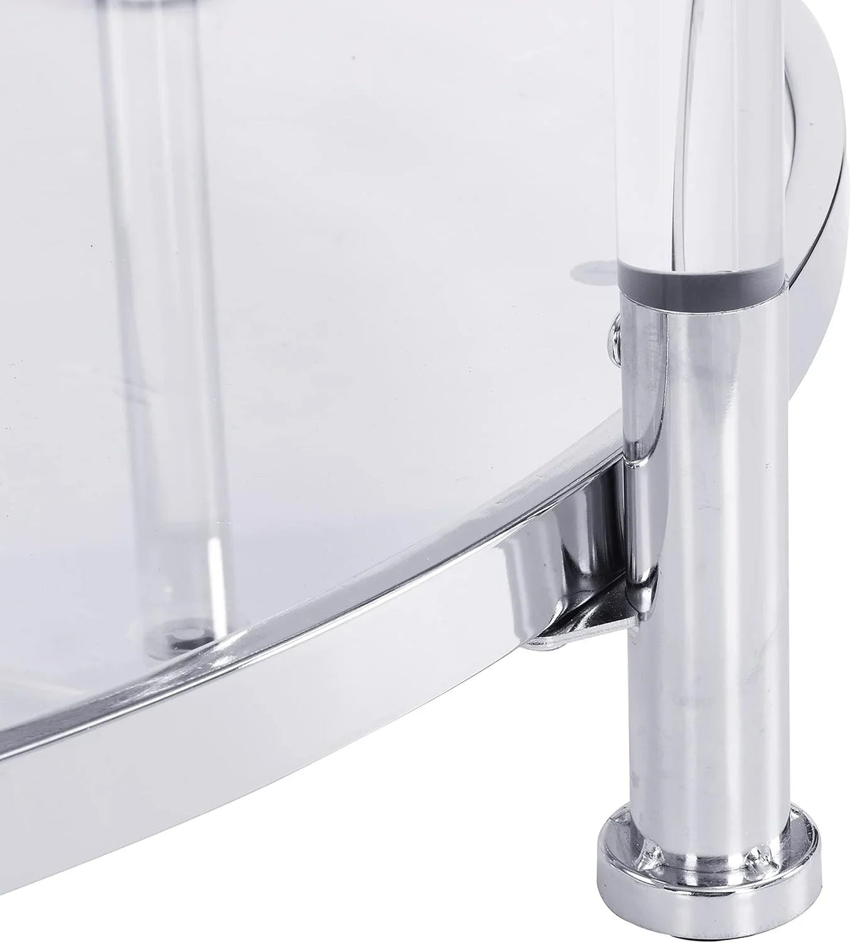 A round coffee table with a metal frame, the surface is made of chrome-plated acrylic glass.